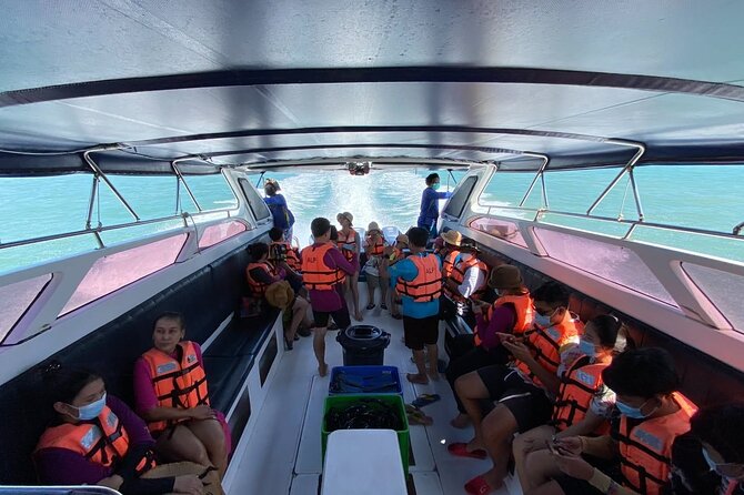 Phi Phi Island Hopping Day Trip by Speed Boat from Phuket - Koh Phi Phi Don: Ton Sai Pier, the banyan tree, and a Thai lunch break