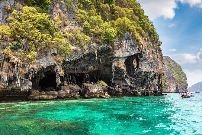Private Phi Phi and Bamboo Islands Snorkeling Tour by Speedboat - Speedboat time to Phi Phi Lee: the big cliffs arrive early