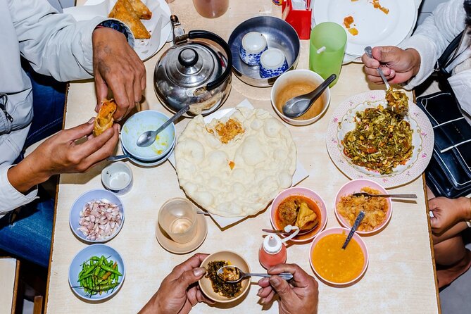 Southern Flavors Phuket Food Tour with 15+ Tastings - Stop one and two: backstreets, curries, noodles, and peanut sauce territory